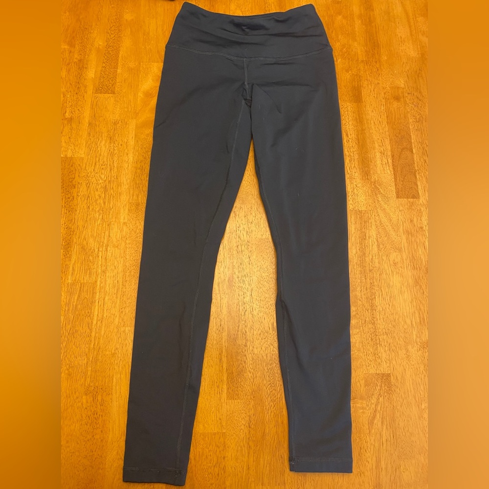 Dark blue/green inner fleece leggings.